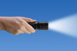 Flashlight with blue sky