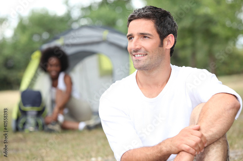 Photo: Couple in front of tent Couple in front of tent