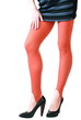 Young fashion woman in red sexy pantyhose holding hand on thigh
