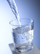 Pouring water into a glass