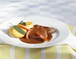 Braised beef with polenta cakes and sage