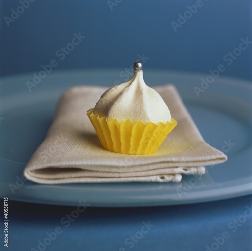 Photo: Small meringue in yellow paper case Small meringue in yellow paper case