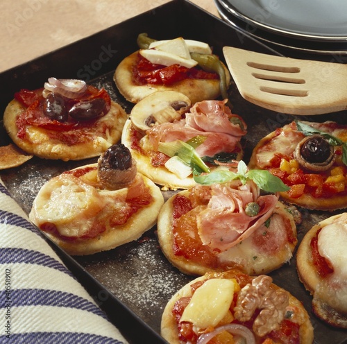 Photo: Mini-pizzas on a baking tray Mini-pizzas on a baking tray