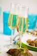 Two glasses of champagne and roast loin of pork