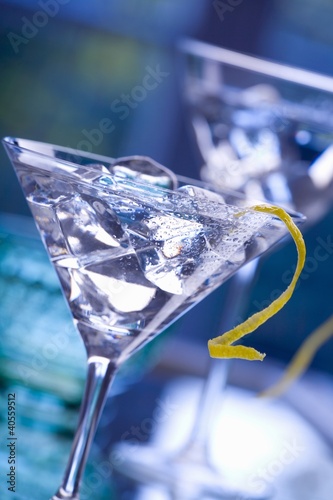 Photo: Martini with lemon peel and ice cubes Martini with lemon peel and ice cubes