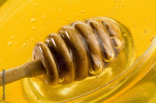 Photo: Honey with honey dipper Honey with honey dipper