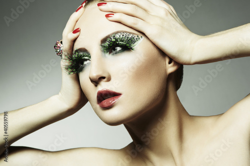 Photo: Fashion photo of a young woman with long eyelashes Fashion photo of a young woman with long eyelashes