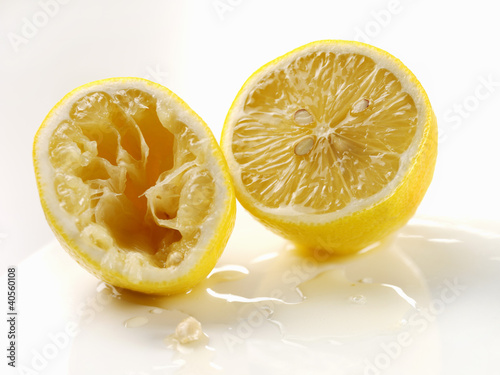 Photo: Two lemon halves, one squeezed Two lemon halves, one squeezed