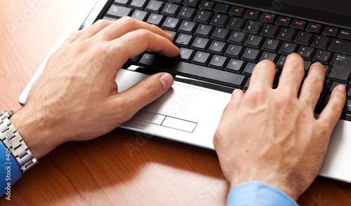 Photo: Businessman working on the laptop Businessman working on the laptop