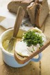 Bread and chives on a butter pot