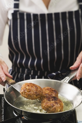 Photo: Frying meat patties in a frying pan Frying meat patties in a frying pan