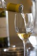 White wine being poured into a glass