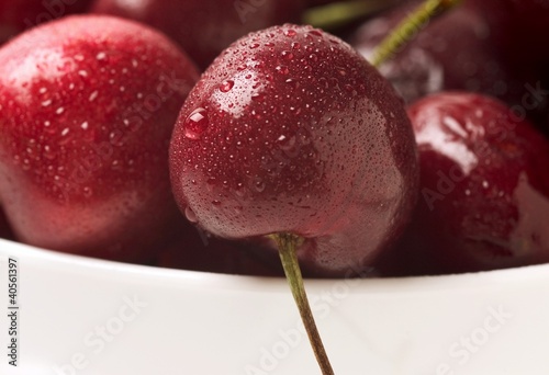 Photo: Cherries covered in condensation in a small bowl Cherries covered in condensation in a small bowl