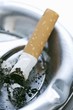 Foto: Cigarette end in an ashtray Cigarette end in an ashtray