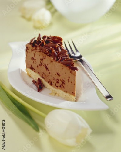 Foto: Piece of hazelnut chocolate cheesecake with grated chocolate Piece of hazelnut chocolate cheesecake with grated chocolate