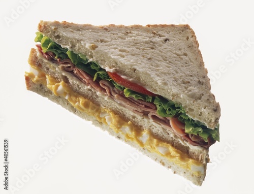 Photo: Double-decker egg, ham & lettuce sandwich in granary bread Double-decker egg, ham & lettuce sandwich in granary bread