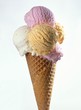 Several scoops of different ice cream in one cone
