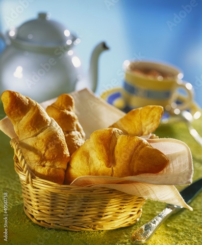 Photo: Croissants in a bread basket for breakfast Croissants in a bread basket for breakfast
