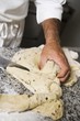 Making olive bread (dividing the dough into portions)
