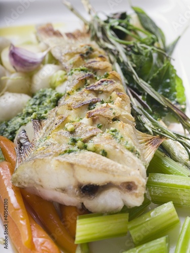 Photo: Fried sea bass with pesto on vegetables Fried sea bass with pesto on vegetables