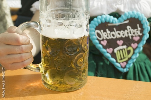 Photo: Woman with litre of beer at Oktoberfest Woman with litre of beer at Oktoberfest