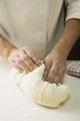 Kneading pizza dough