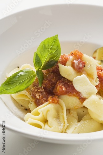 Foto: Tortellini with tomato sauce, butter and basil Tortellini with tomato sauce, butter and basil