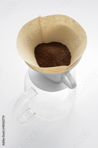 Photo: Ground coffee in filter on glass coffee pot Ground coffee in filter on glass coffee pot