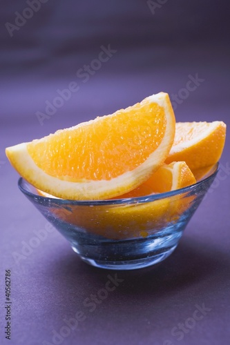 Photo: Several orange wedges in glass bowl Several orange wedges in glass bowl