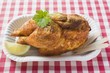 Half a roast chicken in paper dish
