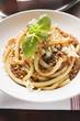 Macaroni with mince sauce, Parmesan and basil