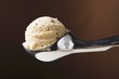Scoop of ice cream in ice cream scoop