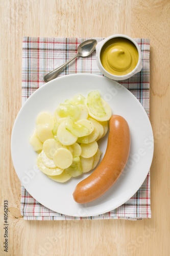 Photo: Frankfurter with potato salad, mustard in small dish Frankfurter with potato salad, mustard in small dish