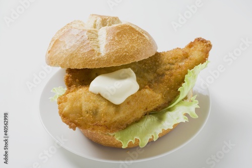 Photo: Breaded fish fillet and mayonnaise in bread roll Breaded fish fillet and mayonnaise in bread roll