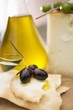 Black olives, crackers, olive oil and Parmesan