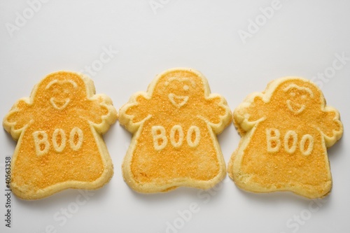 Photo: Three orange ghost biscuits for Halloween Three orange ghost biscuits for Halloween