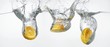 Oranges falling into water
