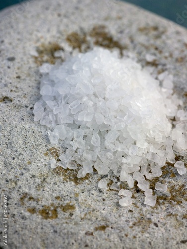 Photo: Coarse sea salt on a stone Coarse sea salt on a stone