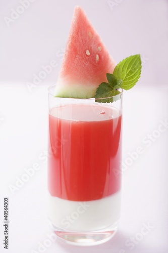 Photo: Watermelon drink with wedge of watermelon and mint leaves Watermelon drink with wedge of watermelon and mint leaves