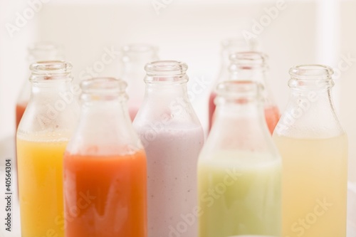 Photo: Various different juices in small bottles Various different juices in small bottles