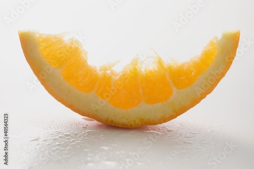 Photo: Wedge of orange, partly eaten Wedge of orange, partly eaten