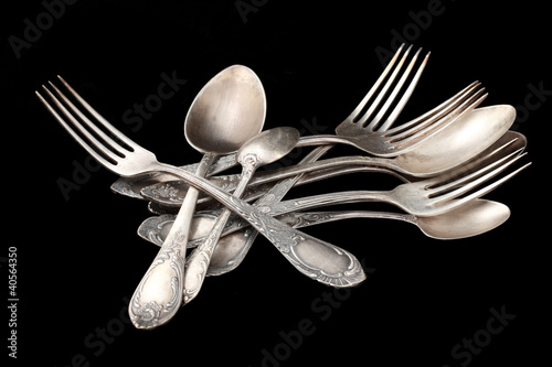 Photo: silverware table silver over black silverware table silver over black