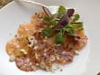 Orange carpaccio with corn salad (overhead view)