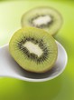 Two halves of a kiwi fruit