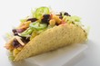 Photo: Taco filled with sweetcorn and beans on paper napkin Taco filled with sweetcorn and beans on paper napkin