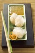 Dim sum with sweet and sour sauce (Asia)