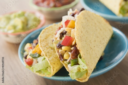 Photo: Vegetable tacos, dips in background (Mexico) Vegetable tacos, dips in background (Mexico)