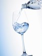 Pouring water into a glass