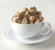 Brown sugar cubes in cup