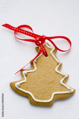 Photo: Fir tree biscuit with red bow Fir tree biscuit with red bow